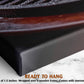The image is a close-up of a black metal object, possibly a piece of machinery or a tool, with a wooden frame. The object is placed on a white marble surface, which has a text overlay that reads "READY TO HANG" and provides the dimensions of the object, stating it is 1.5 inches deep and wrapped over a wooden frame.