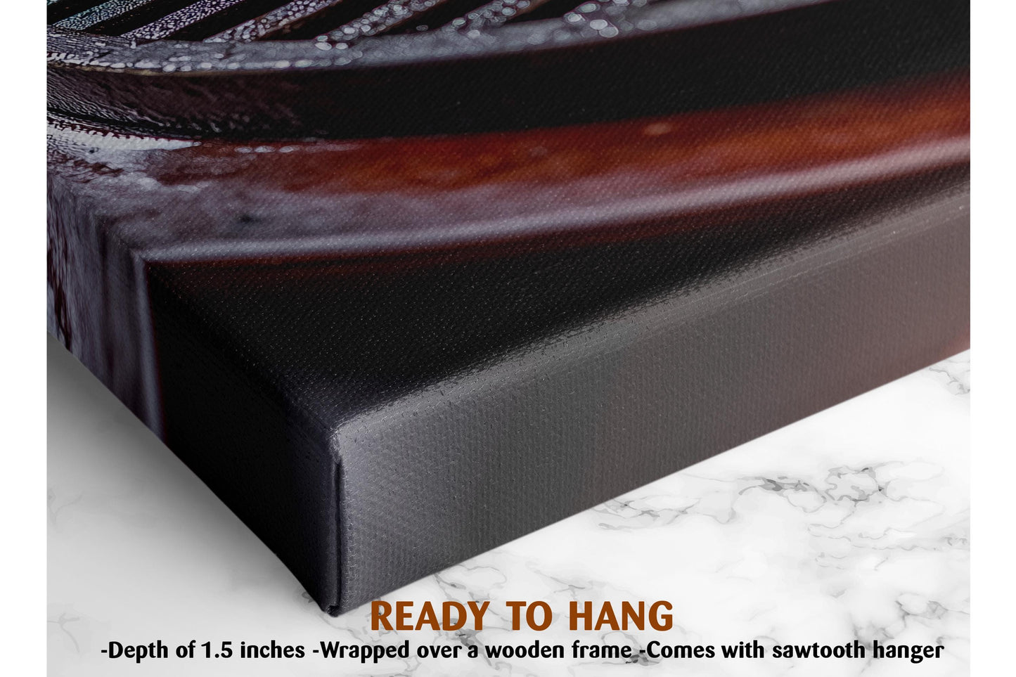 The image is a close-up of a black metal object, possibly a piece of machinery or a tool, with a wooden frame. The object is placed on a white marble surface, which has a text overlay that reads "READY TO HANG" and provides the dimensions of the object, stating it is 1.5 inches deep and wrapped over a wooden frame.