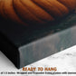 The image is a close-up of a framed print or canvas featuring a close-up of a pumpkin. The print has a textured surface and appears to be a framed artwork.