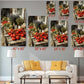The image is a living room with a white couch and a coffee table. Above the couch, there are six framed images of tomatoes displayed on a wall, each with a different size and resolution. The images are arranged in a grid pattern, with the largest one at the top and the smallest at the bottom. The images show various sizes of tomatoes, with some being larger than others, and the resolution of the images varies, ranging from smaller to larger.