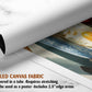 The image is a rolled canvas fabric, which is a type of canvas material used for creating posters or wall art. It is described as a tube-delivered fabric, which means it is delivered in a tube and requires stretching before use. The fabric can be used as a poster and includes a 2.5" edge area.
