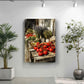 a rustic wooden table filled with an assortment of fresh produce, including tomatoes, herbs, and other vegetables, set against a backdrop of a white wall.
