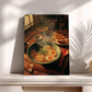 A framed photograph of a bowl of ramen noodles with vegetables, accompanied by a plate of sliced oranges, on a wooden table.