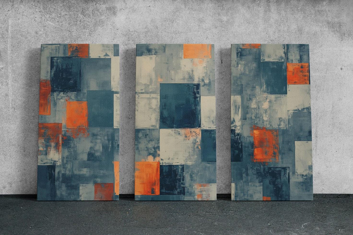 three abstract paintings on a concrete wall