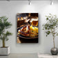 a framed photograph of a plate of sausages and sauerkraut, with a glass of beer nearby, set against a white wall with a potted plant on the left and a plant on the right.