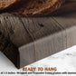 a close-up view of a wooden cutting board with a slice of bread on top, placed on a marble countertop.
