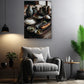 a cozy living room with a comfortable gray armchair, a wooden side table, and a potted plant. Above the armchair, there is a framed photograph of various bowls and dishes, creating a warm and inviting atmosphere.