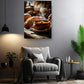 a cozy living room with a comfortable gray armchair, a wooden side table, and a potted plant. Above the armchair, there is a framed photograph of a bowl of soup on a wooden surface, with steam rising from it.