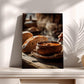 A wooden table with a bowl of soup and a loaf of bread, along with a vase, creating a cozy and rustic atmosphere.