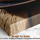 a close-up view of a wooden frame with a textured surface, placed on a marble countertop.