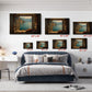 The image is a bedroom with a large bed, a nightstand, and a desk. Above the bed, there are five framed pictures of a scenic view, each with a different size and orientation. The pictures are arranged in a grid-like pattern on the wall, creating a visually appealing display.