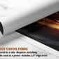 The image is a rolled canvas fabric, which is a type of canvas material used for creating posters or wall art. It is described as a tube-delivered fabric, which means it is delivered in a tube and requires stretching before use. The fabric can be used as a poster and includes a 2.5" edge area.