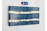 three pieces of blue and white art hanging on a wall