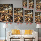 The image is a living room with a white couch and a coffee table. Above the couch, there are multiple framed pictures of a picnic scene, each with different sizes and orientations. The pictures are arranged in a grid-like pattern on the wall, creating a visually appealing display.