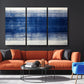 a living room with a couch and two chairs