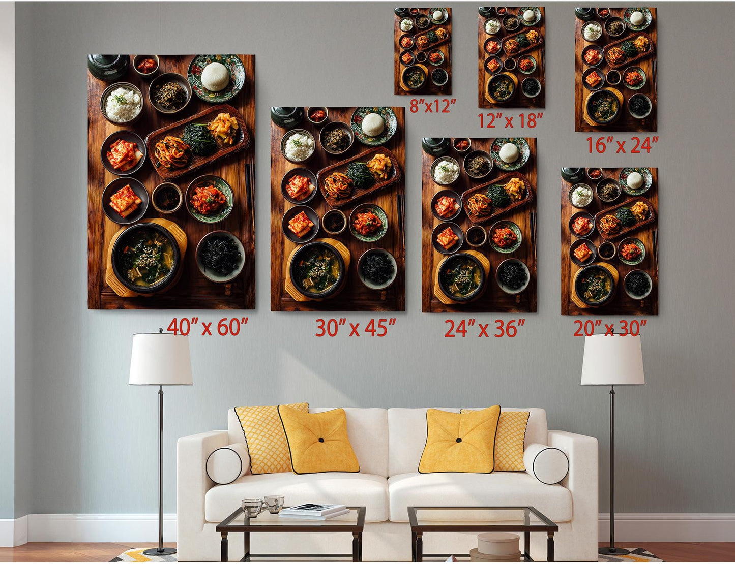 a living room with a white sofa and a coffee table. Above the sofa, there are six framed images of various dishes, including bowls, plates, and other food items. Each image is labeled with its size in inches, ranging from 8"x12" to 24"x36".