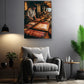 a cozy living room with a comfortable gray armchair, a wooden side table, and a potted plant. Above the armchair, there is a framed photograph of a chef preparing food in a kitchen.